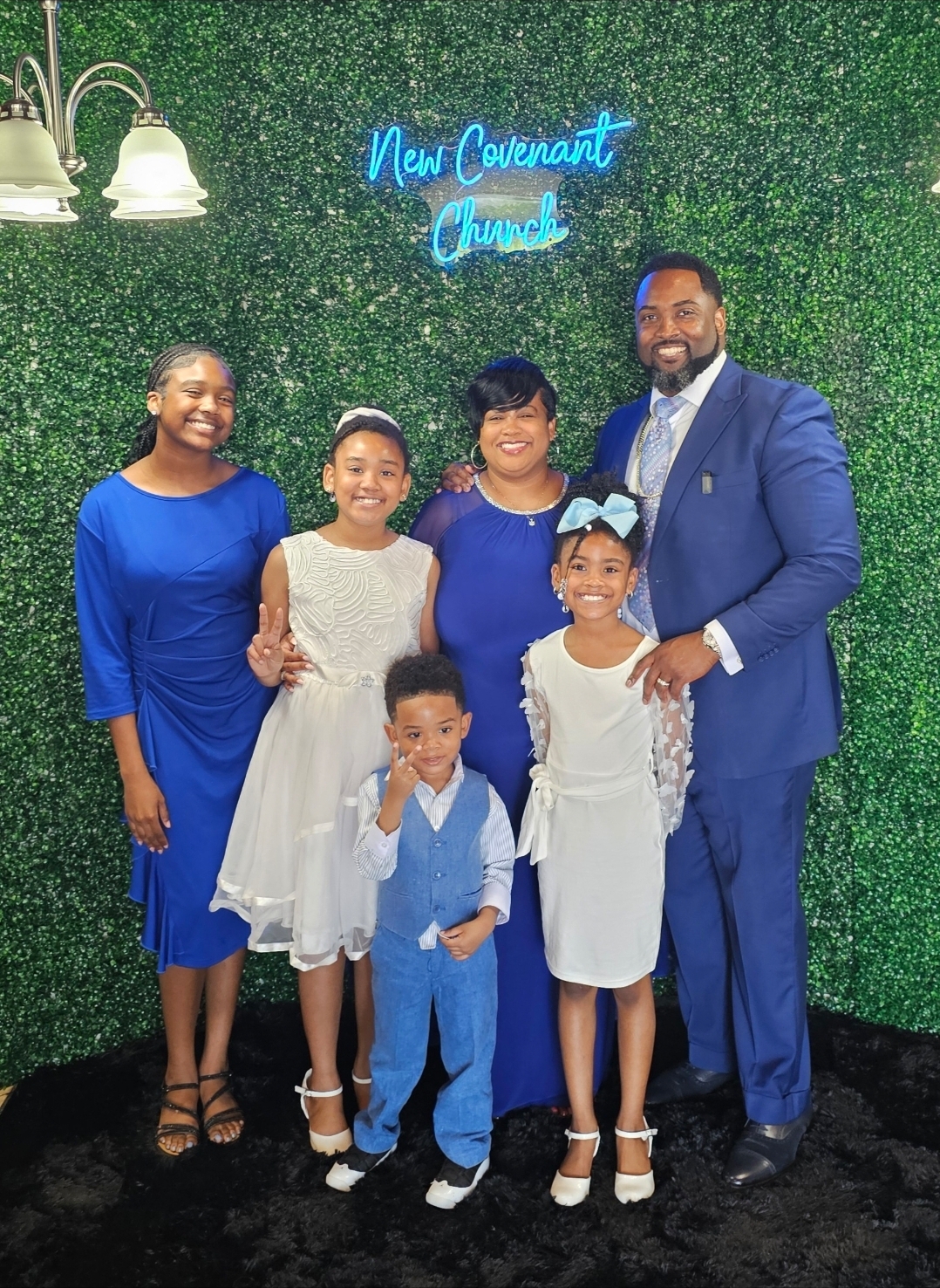 Orrick Quick with his wife and four children at New Covenant Church